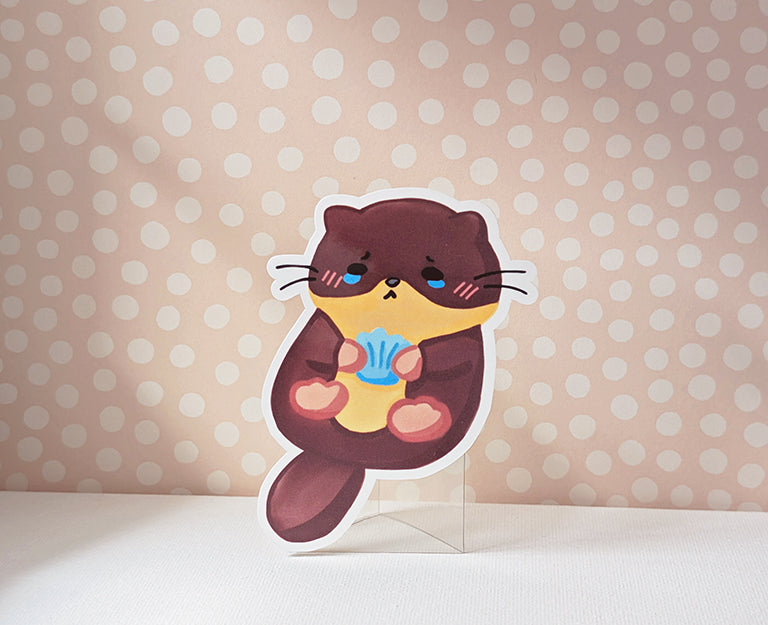 Otter Clutching A Blue Seashell Sticker